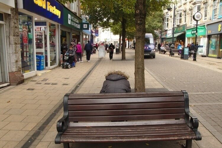street photography humorous man on bench headless