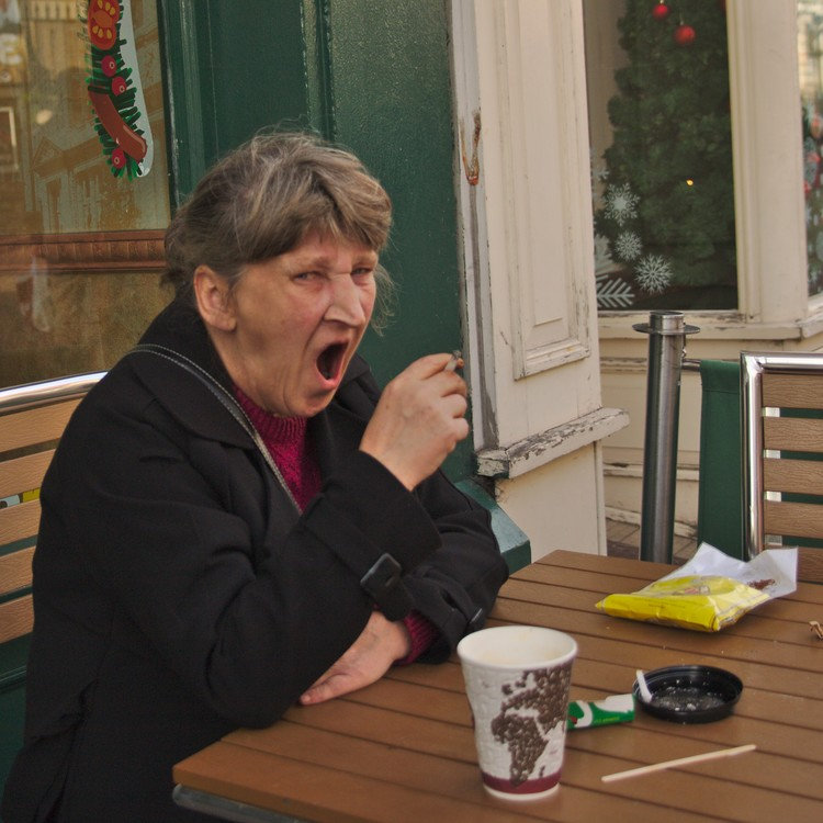 female heavy smoker yawning