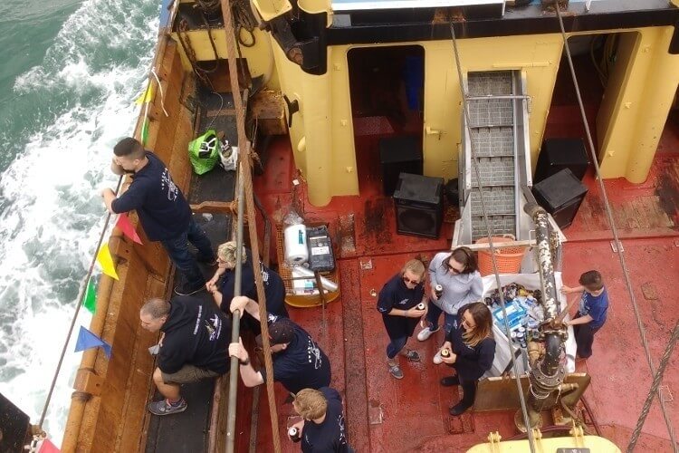 street photography drinking on trawler deck