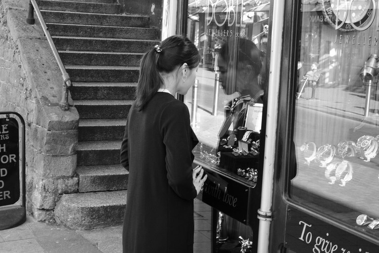 wistfull girl at jewellers